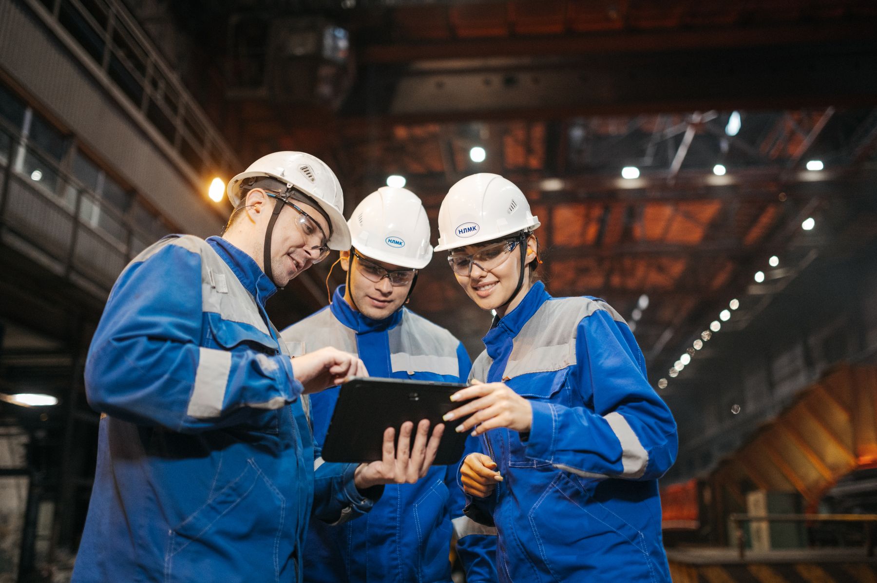 Manufacturing engineers discussing work on the factory floor
