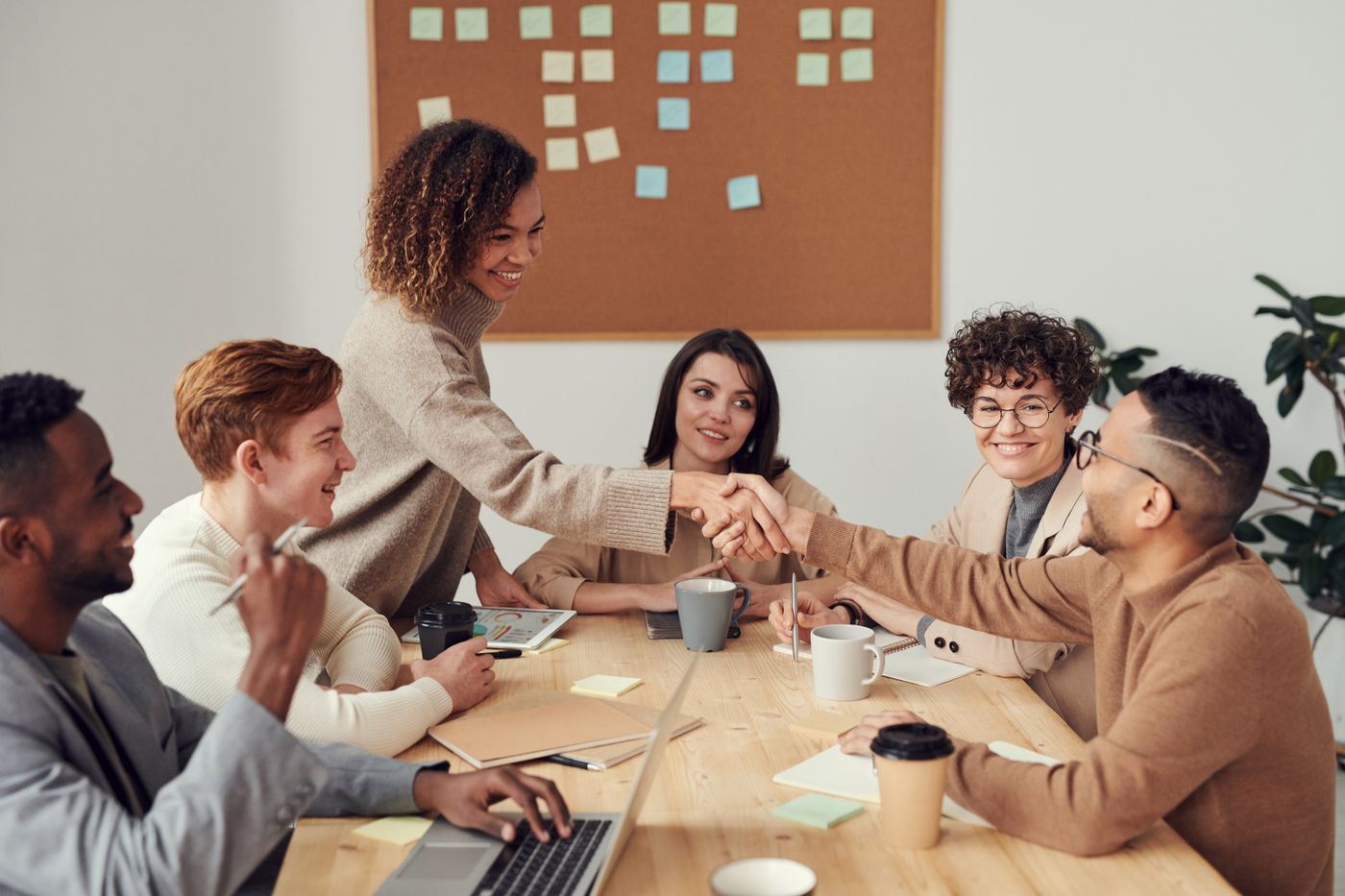 Business professionals collaborating around a meeting table